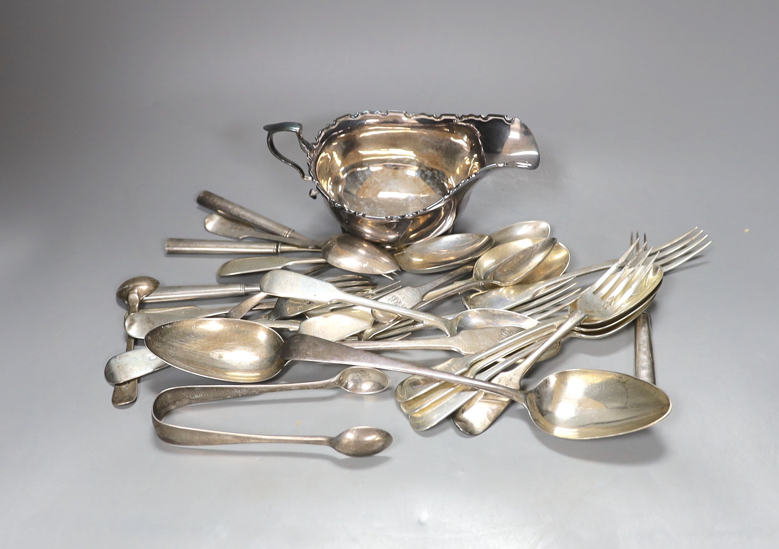 A George V silver sauceboat and a small quantity of assorted mainly 19th century and later silver flatware, 30.5oz and four French white metal tea forks.